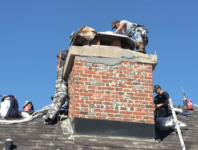 Indian Trail Chimney Sweep installing a custom chimney crown in Indian Trail, NC