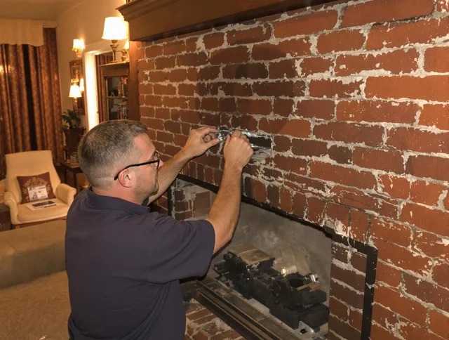 Indian Trail Chimney Sweep expert fixing a fireplace in Indian Trail, NC